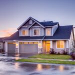 Blue and Gray Concrete House With Attic during Twilight